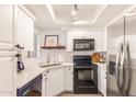 Well-lit kitchen featuring white cabinets, stainless steel appliances, and modern finishes at 7008 E Gold Dust Ave # 236, Scottsdale, AZ 85253