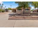 Charming single-story home with a well-maintained yard and covered carport, adding convenience at 7250 E Mckellips Rd, Scottsdale, AZ 85257