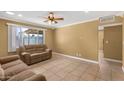 Inviting living room with tile flooring, neutral paint, and a large window offering ample natural light at 7250 E Mckellips Rd, Scottsdale, AZ 85257