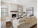 Inviting living area with a fireplace and large windows, offering a comfortable space with modern decor at 7955 E Chaparral Rd # 115, Scottsdale, AZ 85250