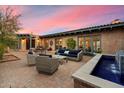 Cozy outdoor patio with comfortable seating and a decorative water feature, perfect for relaxation at 8035 E Paraiso Dr, Scottsdale, AZ 85255