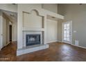 Living room featuring a tile fireplace, tile flooring and access to back yard at 823 W Bradford Dr, Gilbert, AZ 85233