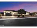 Charming one-story home with well-maintained landscaping and a spacious three-car garage at 9445 W Monte Lindo --, Peoria, AZ 85383