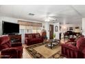 Spacious living room with cozy seating, stylish décor, and ample natural light at 9501 E Broadway Rd # 168, Mesa, AZ 85208