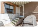 Inviting covered porch with secure door, exterior window, and convenient access steps at 9501 E Broadway Rd # 168, Mesa, AZ 85208