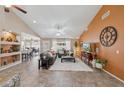 Inviting living room boasts high ceilings, recessed lighting, neutral paint, and an adjacent dining area at 11320 E Newcastle Ave, Mesa, AZ 85209