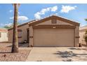 Welcoming home featuring a neutral exterior, easy-care landscaping, and an attached two-car garage at 1507 W Mesquite Ave, Apache Junction, AZ 85120