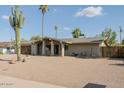Well-kept single story residence showcasing desert landscaping at 2611 E Cheryl Dr, Phoenix, AZ 85028