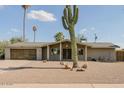 Inviting single-story home with desert landscaping, enhancing its curb appeal at 2611 E Cheryl Dr, Phoenix, AZ 85028