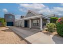 Inviting home featuring desert landscaping, tile roof, covered entry, and a private two-car garage at 2731 E Windsor Ave, Phoenix, AZ 85008