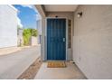 Cozy front porch with a decorative security screen door and 'Home Sweet Home' welcome mat at 2731 E Windsor Ave, Phoenix, AZ 85008