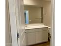 Well-lit bathroom featuring a white vanity with a large mirror and modern fixtures at 31866 N Bandit Rd, San Tan Valley, AZ 85143