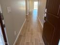 Inviting entryway showcasing stylish wood-look tile floors and neutral wall colors at 31866 N Bandit Rd, San Tan Valley, AZ 85143