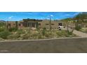 Beautiful desert home exterior featuring a paver driveway and attached garage at 39878 N 105Th Way, Scottsdale, AZ 85262