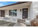 Inviting front porch with a decorative stone pathway and modern front door with glass inserts at 5232 E Dodge St, Mesa, AZ 85205