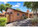 Charming brick home with a private fenced-in patio and a well-manicured yard at 6416 S Kenneth Pl # D, Tempe, AZ 85283