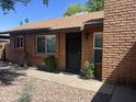 A well-kept brick home with secure front entrance and desert landscaping at 6416 S Kenneth Pl # D, Tempe, AZ 85283