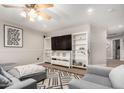 Cozy bonus room featuring built-in shelving, comfortable seating, and a stylish geometric rug at 7029 E Monte Cir, Mesa, AZ 85209