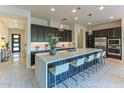 Spacious kitchen boasts a large island, stainless steel appliances, and stylish pendant lighting at 7330 E Vista Bonita Dr, Scottsdale, AZ 85255