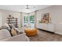 Bright living room with modern furnishings, hardwood floors, and large windows at 818 W Earll Dr, Phoenix, AZ 85013