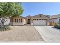 Charming single-story home with a two-car garage and a low-maintenance desert landscape at 1026 E Julie Ave, San Tan Valley, AZ 85140
