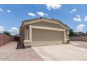 Spacious two-car garage with a wide driveway and neutral paint scheme at 1680 E Cardinal Dr, Casa Grande, AZ 85122