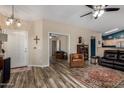 Inviting living room boasts wood-look floors, neutral walls and comfortable seating, creating a warm and welcoming atmosphere at 1680 E Cardinal Dr, Casa Grande, AZ 85122