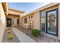 Home showcasing a desert style landscape, brick entryway and a fountain at 2183 W Hawken Way, Chandler, AZ 85286