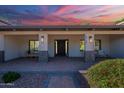 Charming front porch with comfortable seating and stylish lighting, enhancing the home's curb appeal and welcoming ambiance at 2724 W Colt Rd, Chandler, AZ 85224