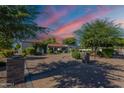Stunning home featuring a circular driveway, desert landscaping, and a tranquil facade perfect for relaxed living at 2724 W Colt Rd, Chandler, AZ 85224