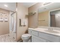 Clean bathroom with white vanity, granite countertop, and a shower-tub combination at 2941 N Oregon St # 12, Chandler, AZ 85225