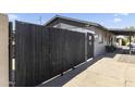A secured gated entry providing privacy and security to the home's side yard at 3307 W Willow Ave, Phoenix, AZ 85029
