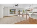 Bright and spacious living room with tile floors, large windows, and views of the pool at 4121 E Patrick St, Gilbert, AZ 85295