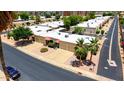 Aerial view of a residential neighborhood with well-maintained homes, landscaping, and ample parking at 4501 E Carol Ave # 77, Mesa, AZ 85206