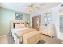 Cozy bedroom featuring soft carpet, a comfortable bed, and ample natural light at 4501 E Carol Ave # 77, Mesa, AZ 85206