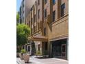 Elegant building entrance featuring architectural details, planters and awning at 114 W Adams St # 505, Phoenix, AZ 85003
