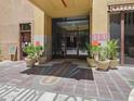 Welcoming building entrance with tiled walkway and planters, providing a professional atmosphere at 114 W Adams St # 505, Phoenix, AZ 85003