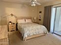 Well-lit main bedroom features a sliding door to the exterior and stylish decor at 120 N Val Vista Dr # 272, Mesa, AZ 85213