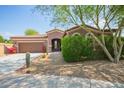 Charming single story home featuring low maintenance desert landscaping and attached two car garage at 1225 S 160Th Ln, Goodyear, AZ 85338