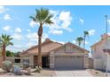 Charming single-story home featuring a tile roof, desert landscaping, and a spacious two-car garage at 1228 E Mountain Vista Dr, Phoenix, AZ 85048