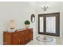 Elegant foyer with a decorative tile floor, statement lighting fixture, and stylish console table at 1228 E Mountain Vista Dr, Phoenix, AZ 85048