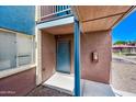 Apartment entryway with blue door and trim at 16602 N 25Th St # 114, Phoenix, AZ 85032