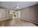 Open concept living area with view into the kitchen at 16602 N 25Th St # 114, Phoenix, AZ 85032