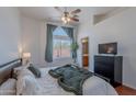 Comfortable bedroom with large window, soft lighting, and ensuite bathroom access at 17403 N 16Th Pl, Phoenix, AZ 85022