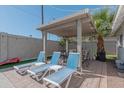 Inviting outdoor patio area with lounge seating and a shaded pergola at 1749 E Medlock Dr, Phoenix, AZ 85016
