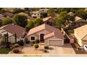Well-maintained single-Gathering home featuring desert landscaping and a two-car garage at 300 W Cardinal Way, Chandler, AZ 85286
