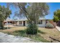 Charming single-story home with a well-manicured front yard and a covered carport at 3001 N 21St Ave, Phoenix, AZ 85015