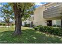 Inviting condo showcases well-maintained landscaping and mature trees, creating a peaceful setting at 4610 N 68Th St # 411, Scottsdale, AZ 85251