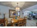 Traditional dining room features a wood table, decorative lighting, and a large mirror that enhances the space at 5119 N 87Th St, Scottsdale, AZ 85250