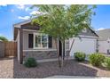 Home exterior with stone accents, desert landscaping, and a welcoming entrance with good curb appeal at 5808 S 12Th Ln, Phoenix, AZ 85041